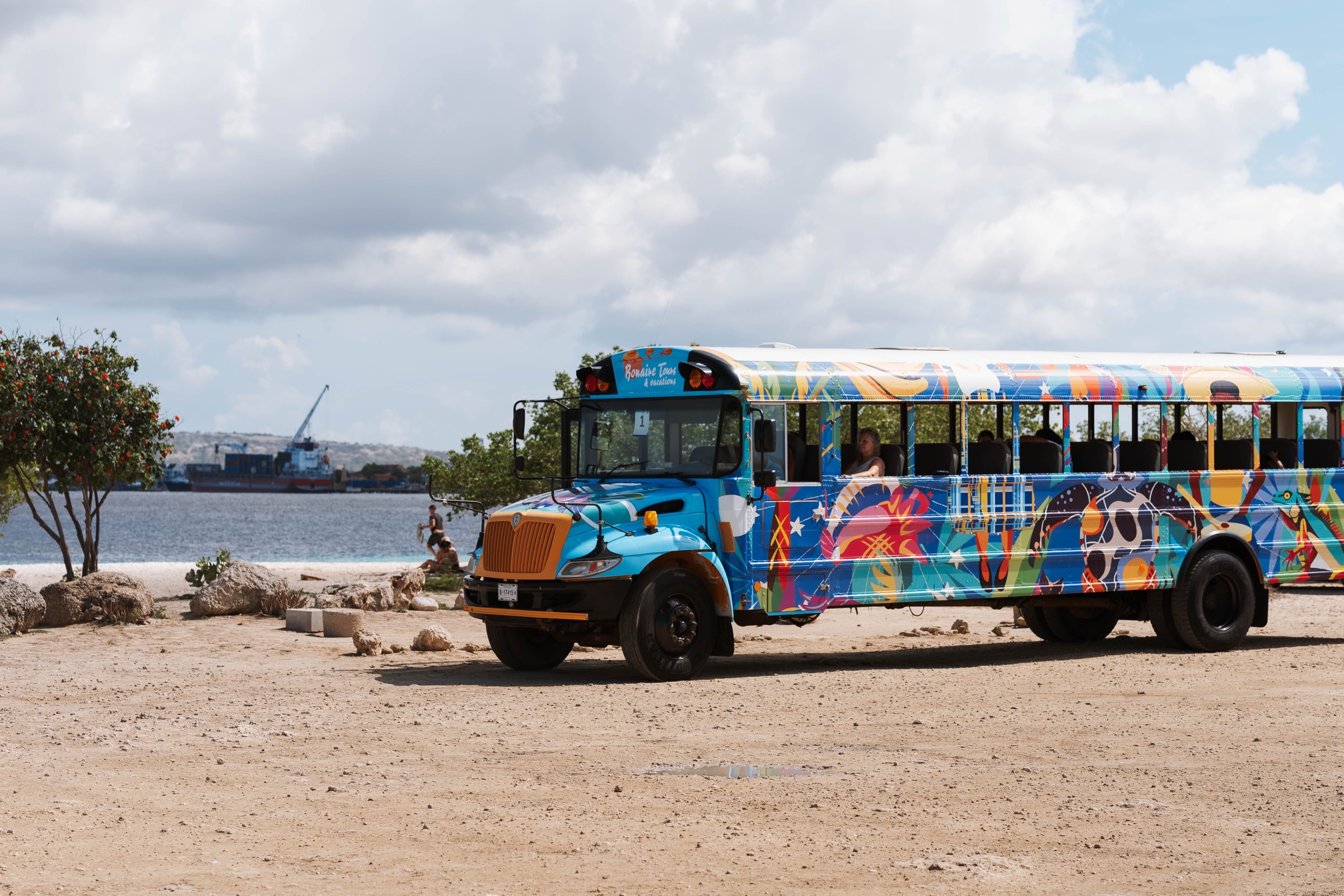 Bonaire Tours open bus — Our colorful open-sided island bus — the fun, breezy way to sightsee and beach-hop with a big group